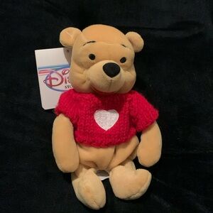 Disney Store Pooh Bear with ❤️ sweater. 7” bean bag.